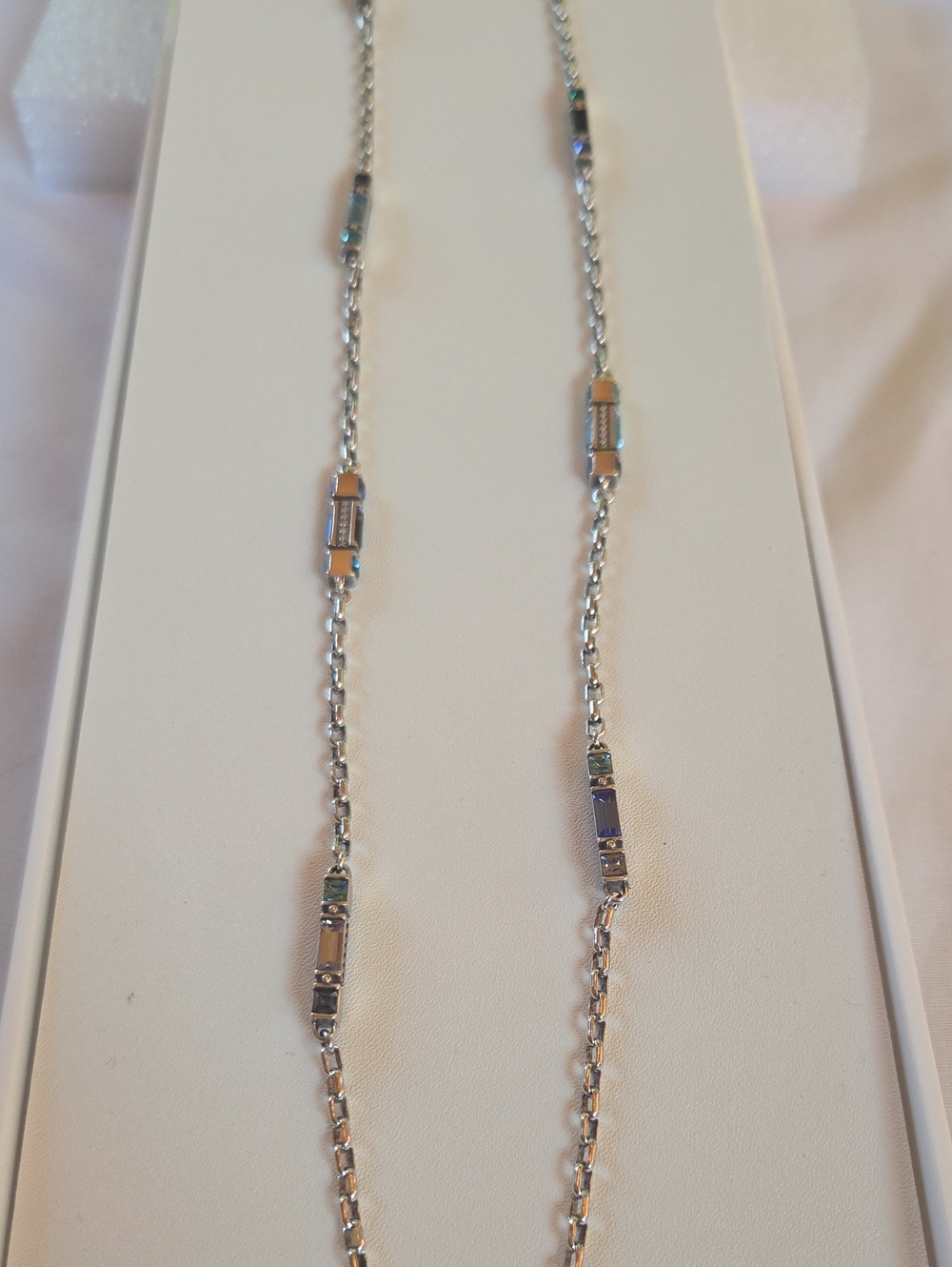 Elegant Silver-Tone Station Chain Necklace with Blue Accents